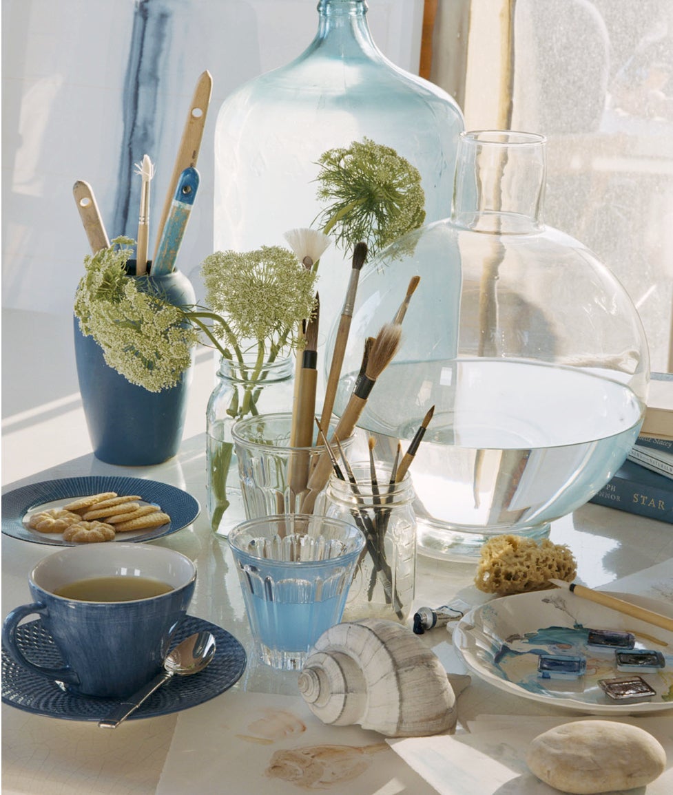 Artful combinations: humble wildflowers in humble jars and a bouquet of brushes for an artistic touch