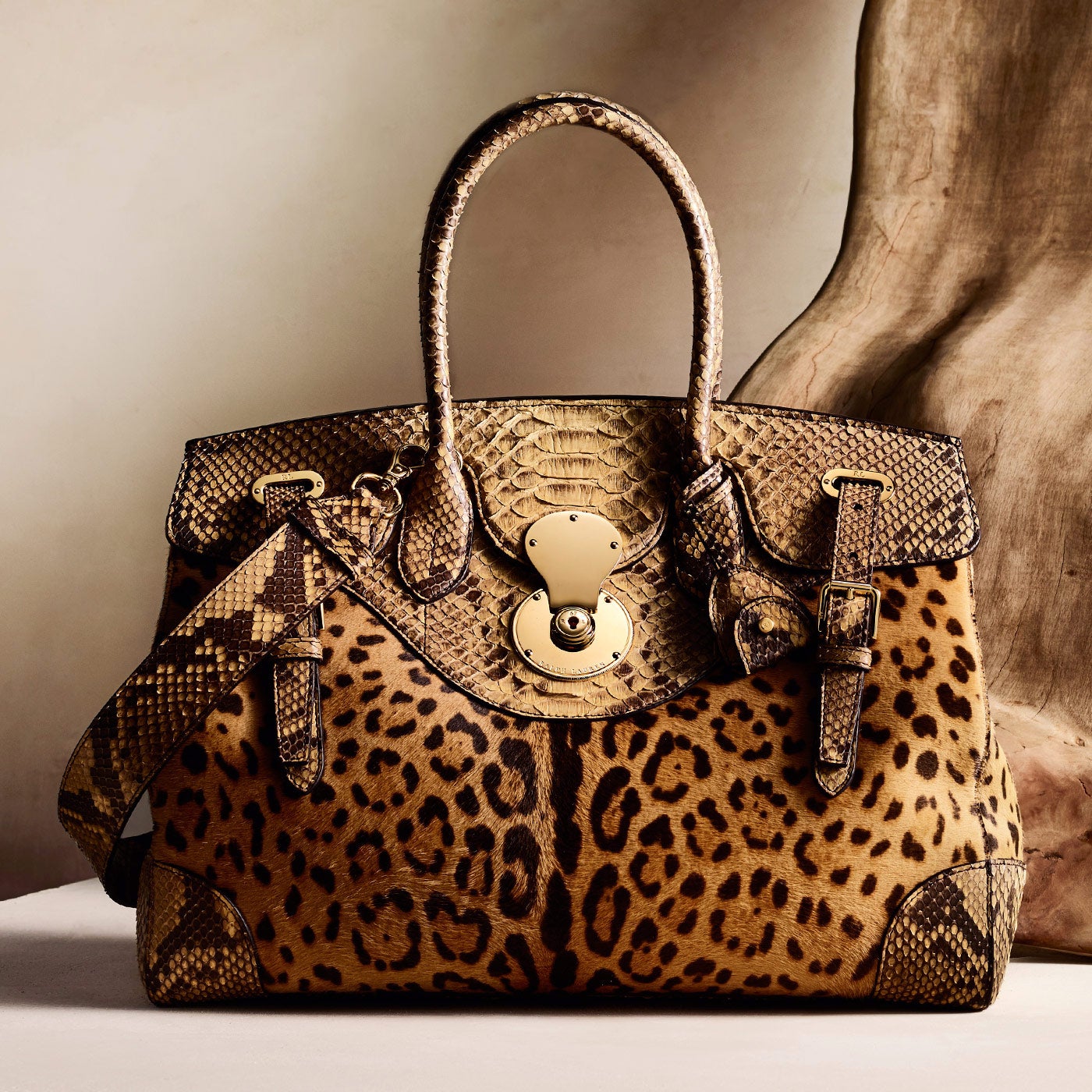 <p><span>A signature Ralph Lauren silhouette, the Ricky creates a dynamic play between texture and pattern using leopard-print haircalf and exotic python</span></p>