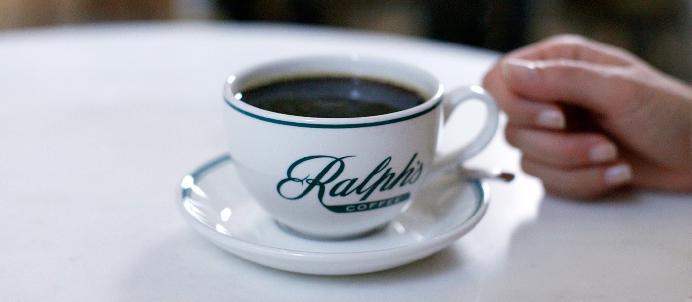  Providing a calm respite for shoppers, the simply designed coffee shop makes the hustle and bustle of Fifth Avenue, visible from its windows, seem far away