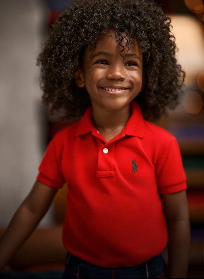 Boy wears customized Polo shirt.