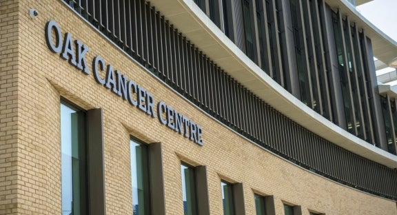 Photograph of facade of cancer center building.